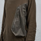 <span>27.1</span><span>"DISPLACEMENT"</span>HOODED POCKET SWEATER<br>COTTON PIQUE<br>OLIVE